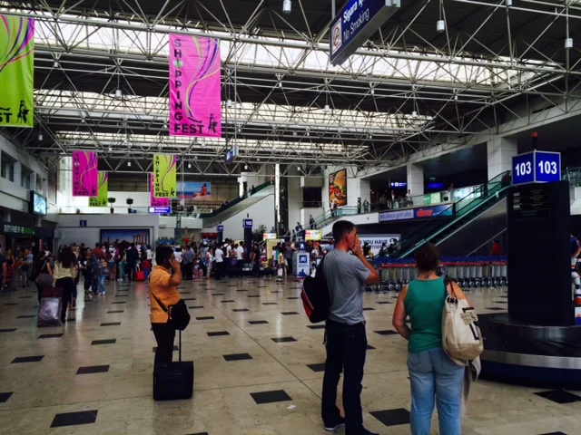 Arrivals area inside Antalya Airport's international terminal, where travellers decide how to reach their hotel