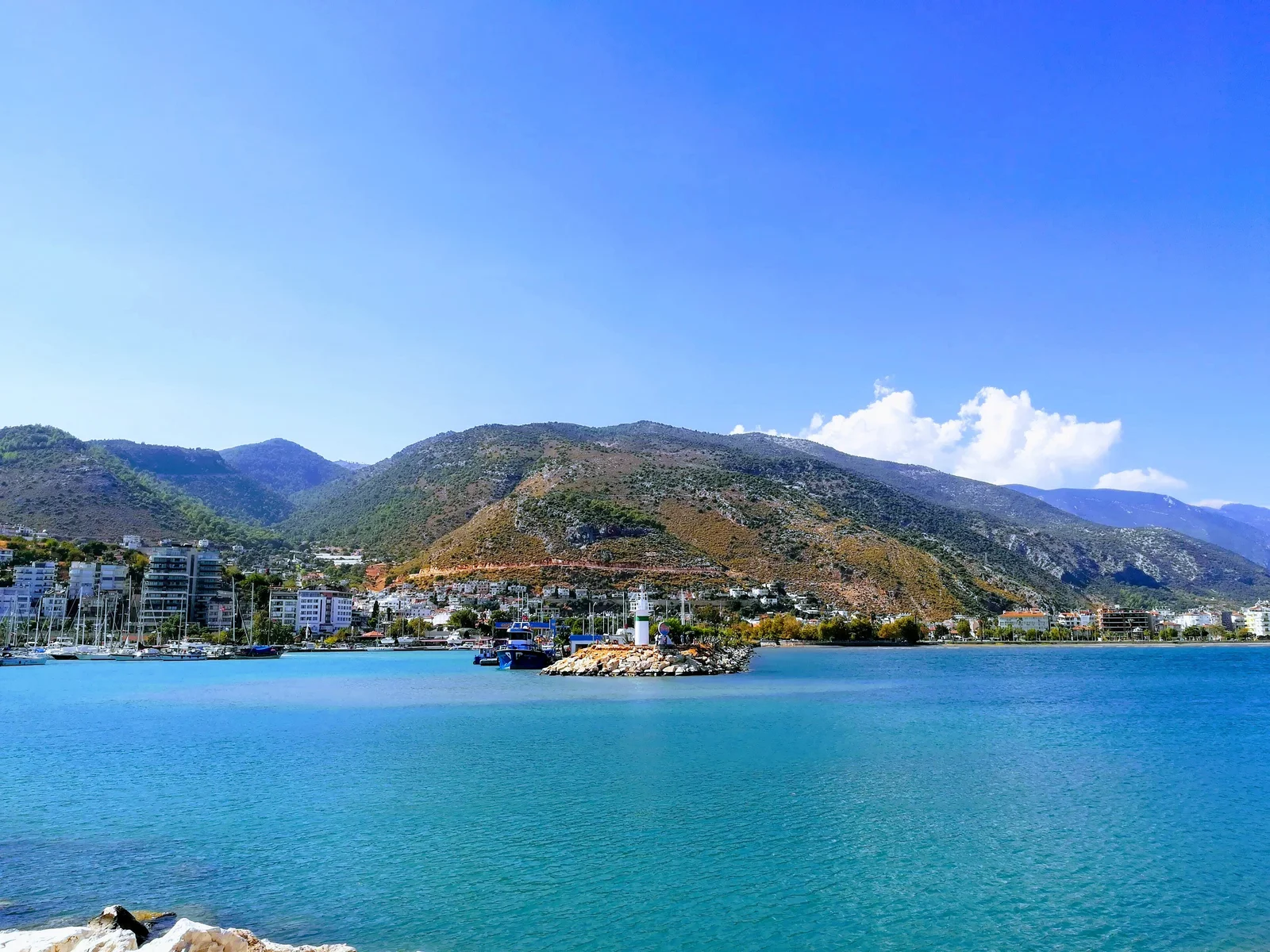 Finike harbour, marina and town centre beneath the mountains