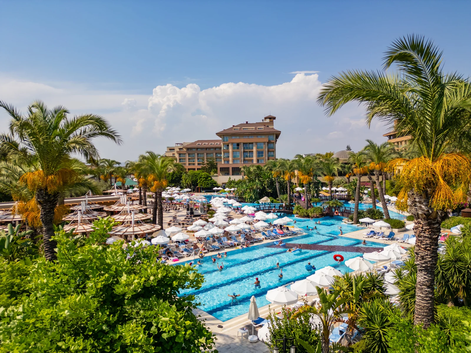 Pool and palm garden at Kumköy Beach Resort in Side