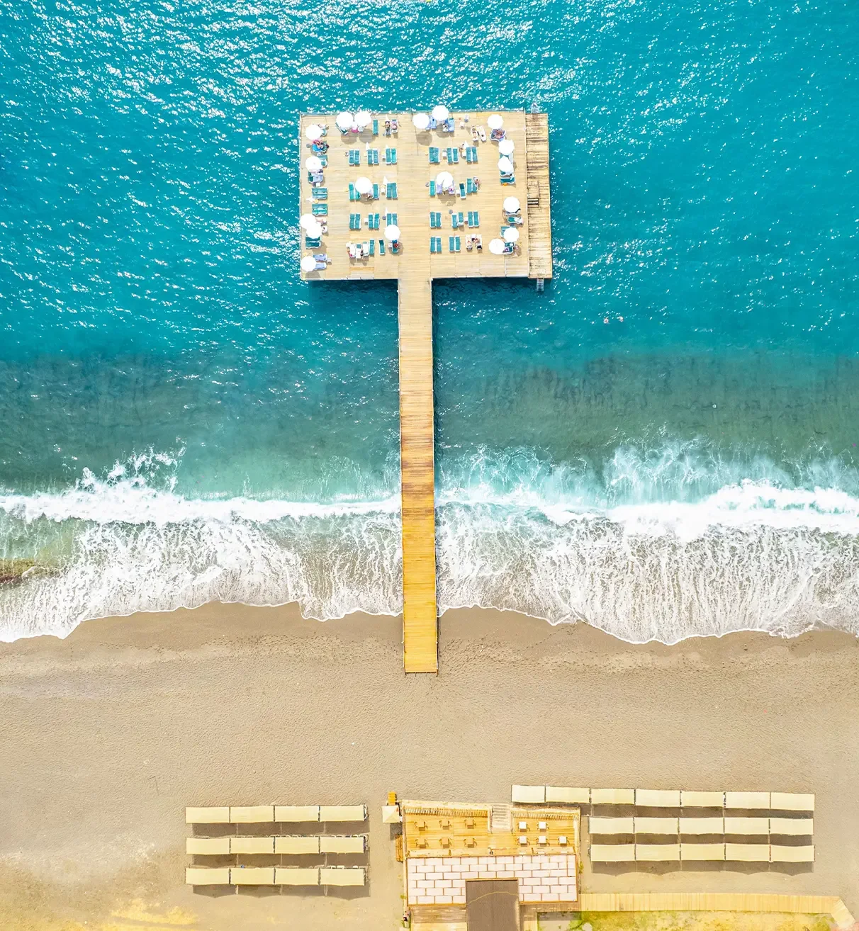 Aerial view of the sandy Mahmutlar beach and Grand Santana sunbathing pier