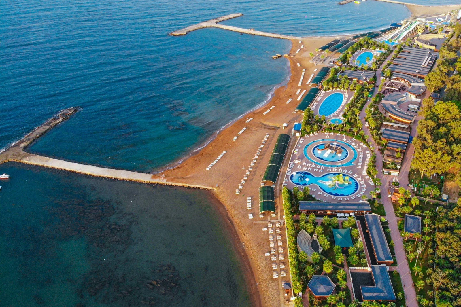 Aerial view of the beach and pools at an Eftalia resort on the Türkler coast